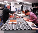 Twop scientists in a lab working on sediment cores